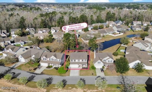 bird's eye view with a residential view and a water view