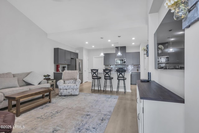 living room with light hardwood / wood-style floors