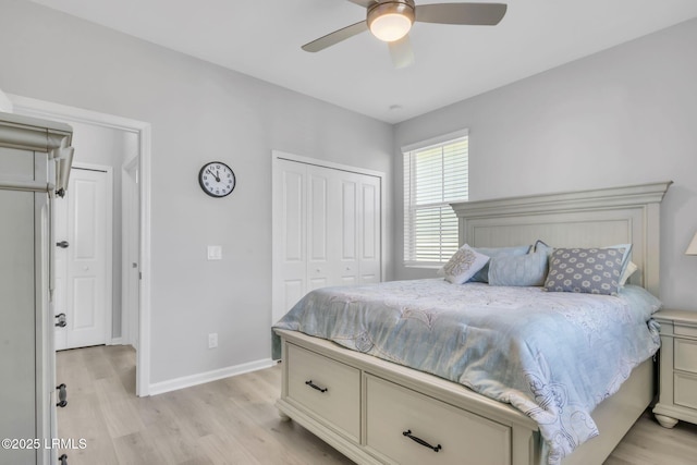 bedroom featuring ceiling fan, light hardwood / wood-style floors, and a closet