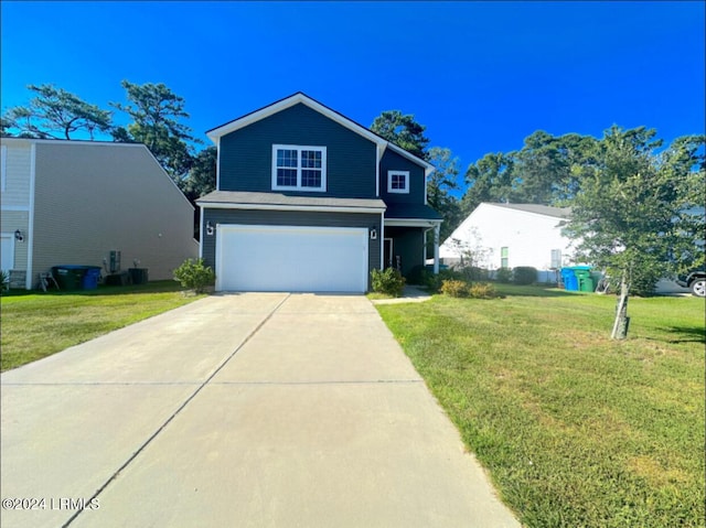 front of property with a garage and a front lawn