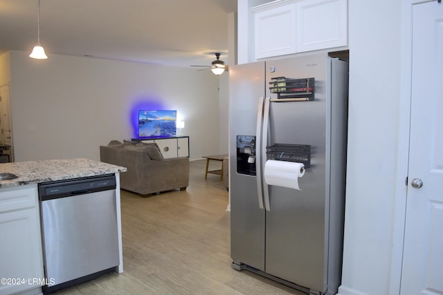 kitchen with ceiling fan, appliances with stainless steel finishes, hanging light fixtures, light hardwood / wood-style floors, and white cabinets