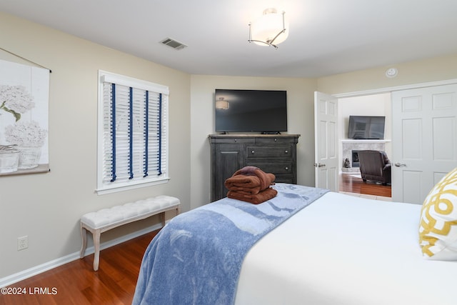 bedroom featuring dark wood-type flooring