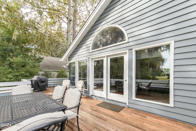 wooden terrace featuring grilling area