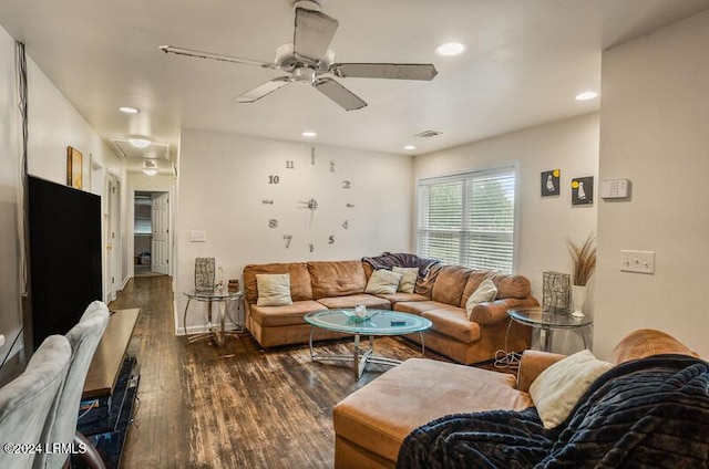 living room featuring dark hardwood / wood-style flooring and ceiling fan