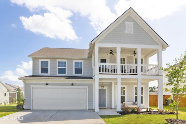 view of front of property with a porch, a balcony, a garage, ceiling fan, and a front yard