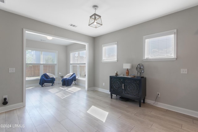 sitting room with light wood-type flooring