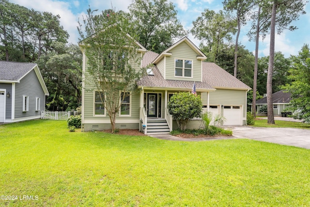 view of front of home with a garage and a front yard