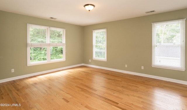 spare room with light wood-type flooring