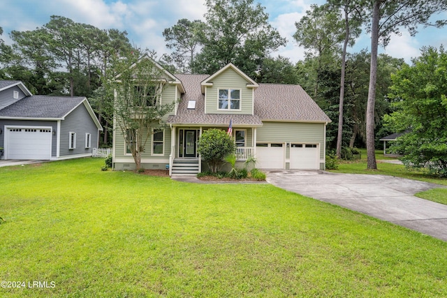 view of front of home with a garage, covered porch, and a front yard