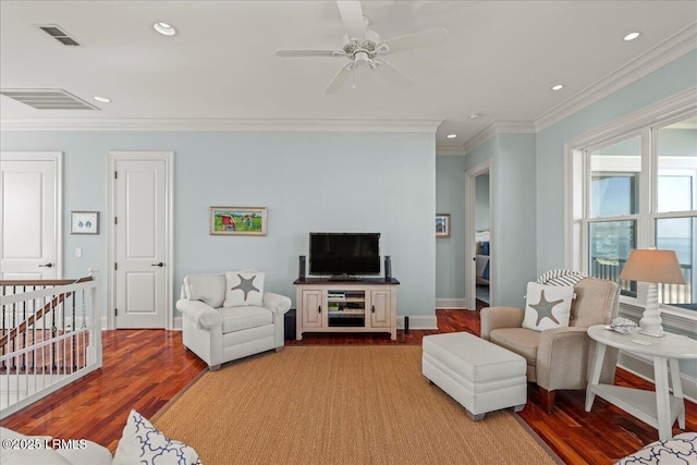 living area featuring recessed lighting, visible vents, crown molding, and wood finished floors