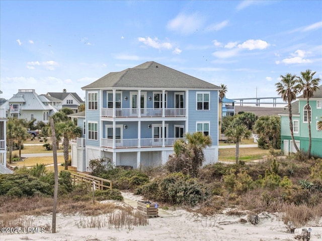 rear view of house featuring a balcony