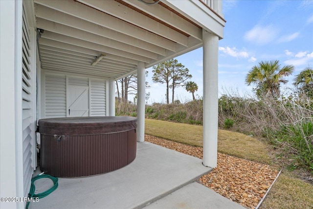 view of patio / terrace featuring a hot tub