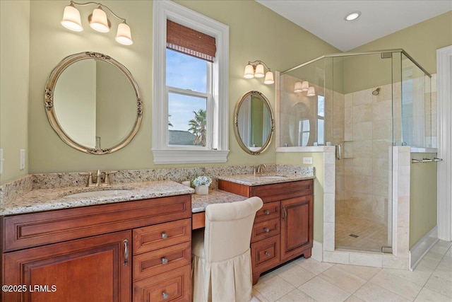 bathroom featuring a shower stall, tile patterned flooring, and vanity