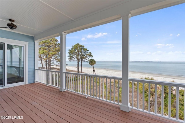 deck with a water view and a view of the beach