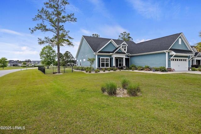 view of front of property with driveway, a garage, fence, and a front lawn