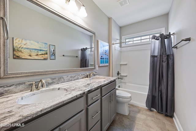 full bath featuring double vanity, shower / bath combo with shower curtain, a sink, and visible vents