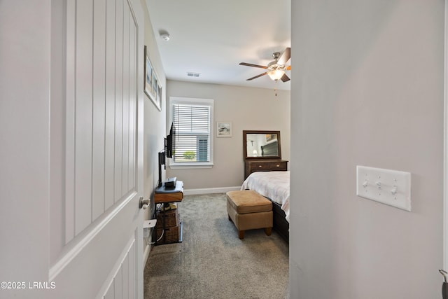 bedroom featuring carpet flooring, visible vents, baseboards, and ceiling fan