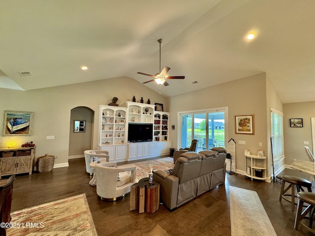living room with arched walkways, dark wood-style flooring, a ceiling fan, and vaulted ceiling