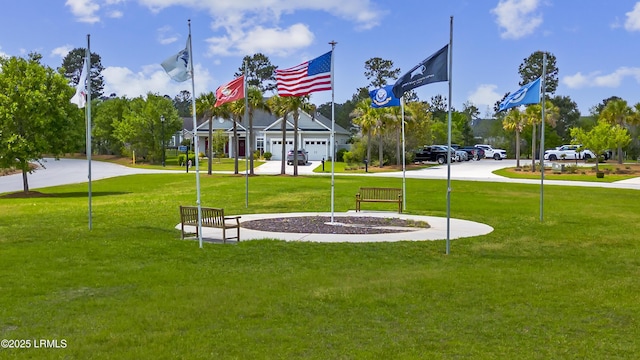 view of property's community with a yard