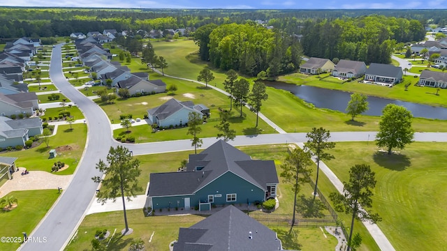 drone / aerial view with a residential view and a water view