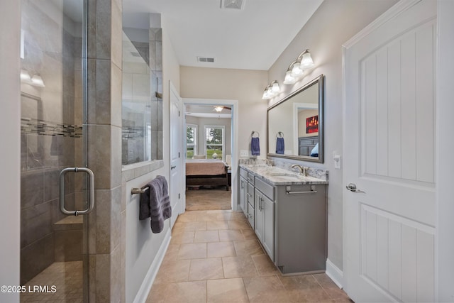 ensuite bathroom featuring vanity, ensuite bathroom, a shower stall, visible vents, and ceiling fan