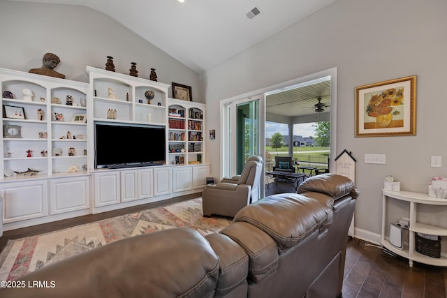 living room featuring dark wood-style floors, baseboards, lofted ceiling, and visible vents