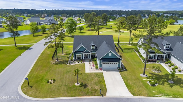 aerial view featuring a residential view and a water view