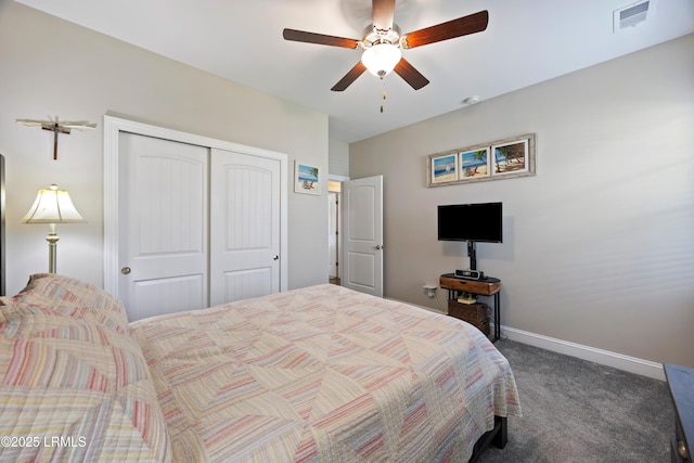 carpeted bedroom with a closet, ceiling fan, baseboards, and visible vents