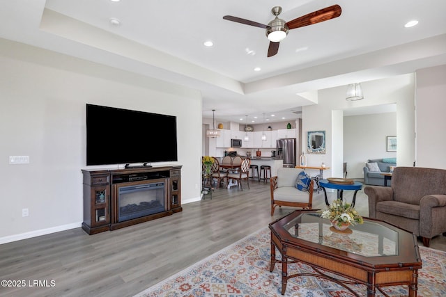 265 Beachcomber Blvd, Hardeeville, SC 29927 - living area featuring recessed lighting, light wood-type flooring, a glass covered fireplace, and baseboards
