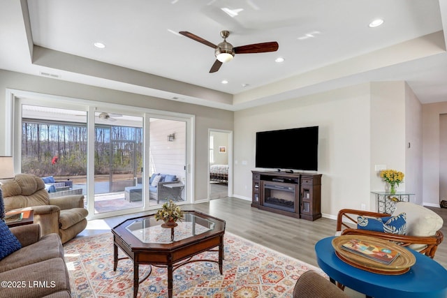 265 Beachcomber Blvd, Hardeeville, SC 29927 - living room featuring recessed lighting, visible vents, baseboards, light wood-style floors, and a tray ceiling