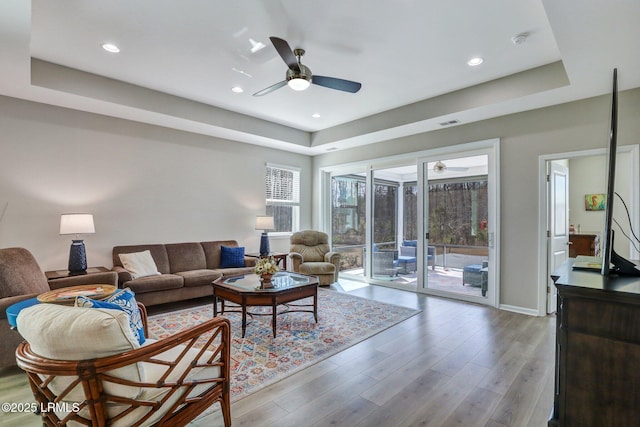 265 Beachcomber Blvd, Hardeeville, SC 29927 - living room featuring baseboards, visible vents, wood finished floors, a tray ceiling, and recessed lighting