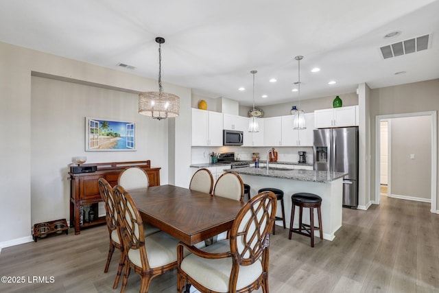265 Beachcomber Blvd, Hardeeville, SC 29927 - dining space featuring light wood-style flooring, visible vents, baseboards, and recessed lighting
