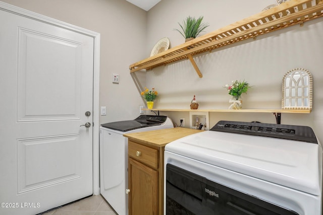 265 Beachcomber Blvd, Hardeeville, SC 29927 - laundry room with washing machine and dryer and light tile patterned floors