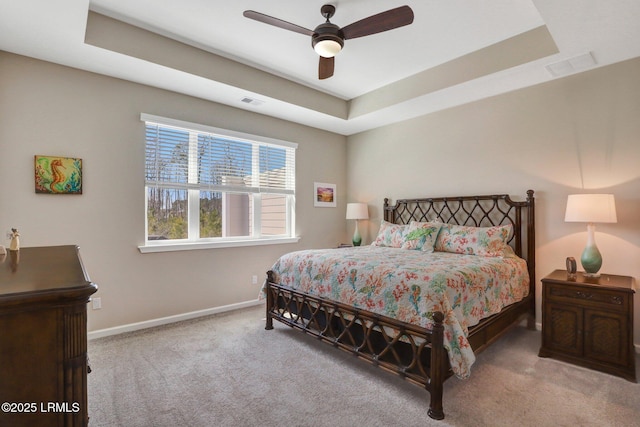 265 Beachcomber Blvd, Hardeeville, SC 29927 - bedroom featuring a tray ceiling, carpet flooring, visible vents, and baseboards