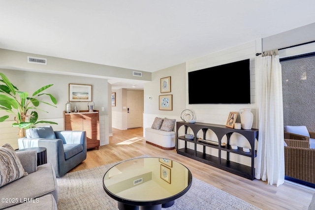 living room with light hardwood / wood-style flooring