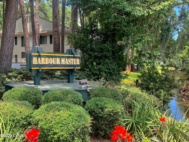 community sign with a water view