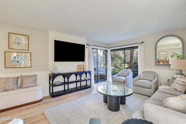 living room with light hardwood / wood-style floors