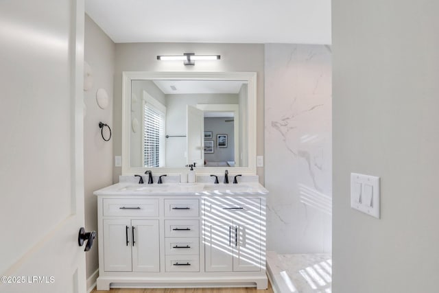 bathroom with vanity and walk in shower