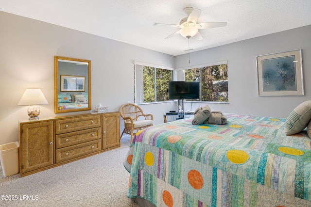 bedroom featuring light carpet and ceiling fan