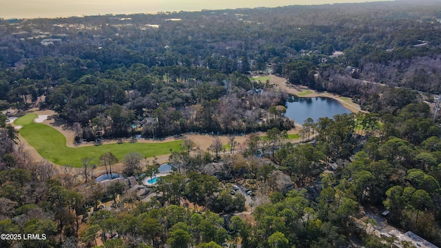 aerial view at dusk featuring a water view