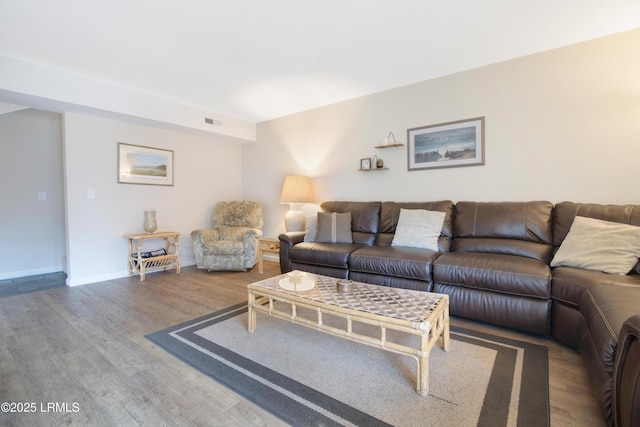 living room featuring dark wood-type flooring