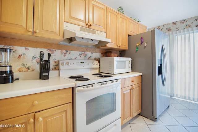 kitchen with tasteful backsplash, white appliances, light brown cabinets, and light tile patterned floors