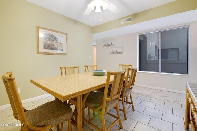 tiled dining room featuring ceiling fan