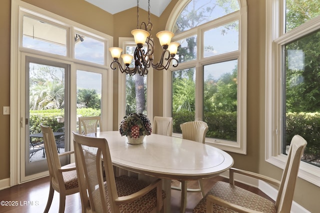 283 Seabrook Dr, Hilton Head Island, SC 29926 - dining room with baseboards, a chandelier, plenty of natural light, and dark wood-style floors