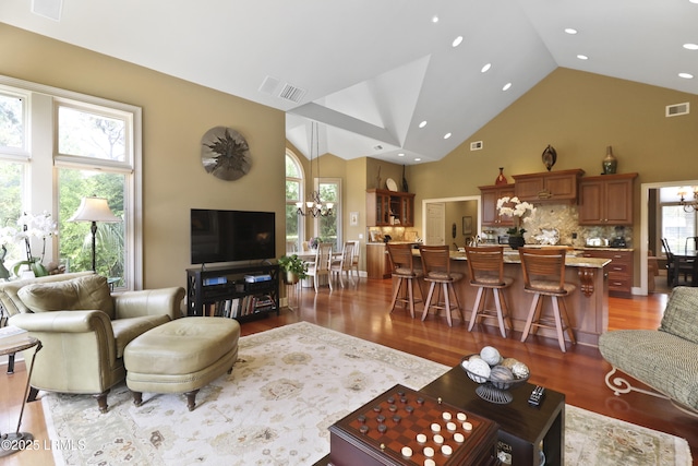 283 Seabrook Dr, Hilton Head Island, SC 29926 - living area featuring a chandelier, light wood-type flooring, high vaulted ceiling, healthy amount of natural light, and recessed lighting