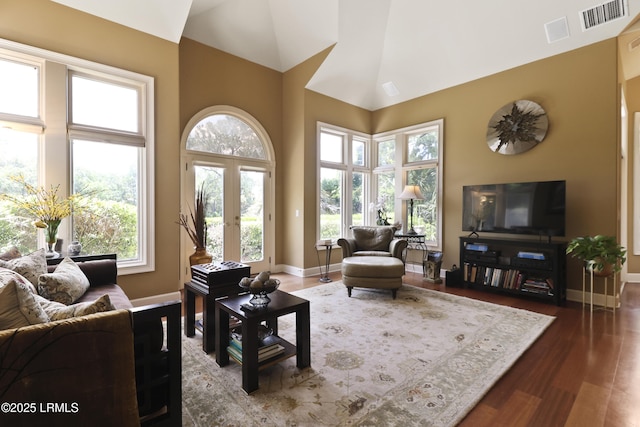 283 Seabrook Dr, Hilton Head Island, SC 29926 - living area with baseboards, wood finished floors, french doors, and high vaulted ceiling