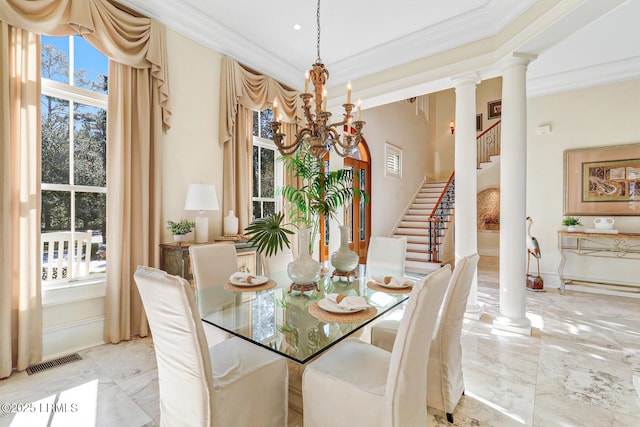 dining room featuring decorative columns, visible vents, ornamental molding, marble finish floor, and an inviting chandelier