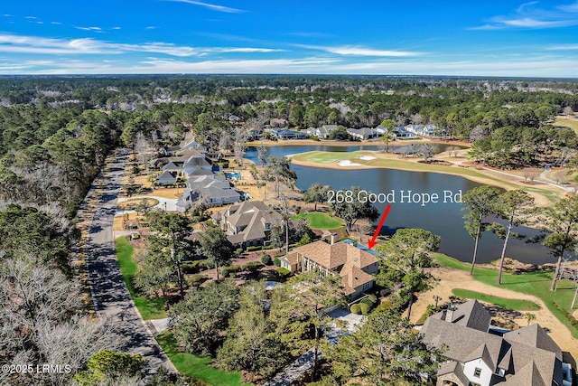 drone / aerial view with a water view and a residential view