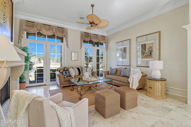 living area with marble finish floor, french doors, a premium fireplace, ornamental molding, and a ceiling fan