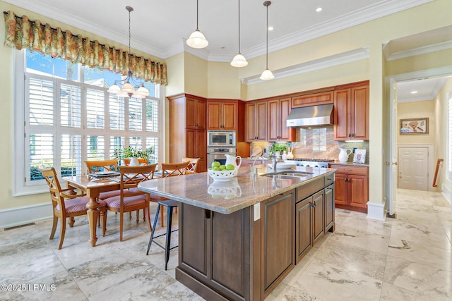 kitchen featuring visible vents, marble finish floor, stainless steel appliances, extractor fan, and crown molding